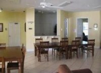 Forest Lake clubhouse meeting room with tables and chairs