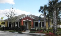 Forest Lake community club house exterior with palm trees